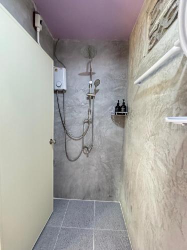 a bathroom with a shower with a purple ceiling at Serenity House 4D in Ban Ko Khwan