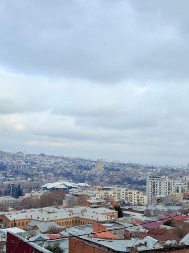 a view of a city with buildings at Cosy City-View Flat in Mtatsminda, flat 5 in Itʼkhvisi