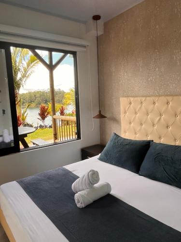 Giường trong phòng chung tại Entre Aguas Hotel