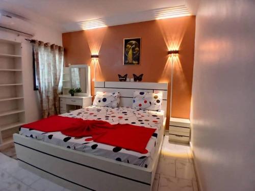 Llit o llits en una habitació de Résidence Latifa Angré
