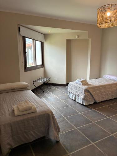 Un ou plusieurs lits dans un hébergement de l'établissement White House Cafayate