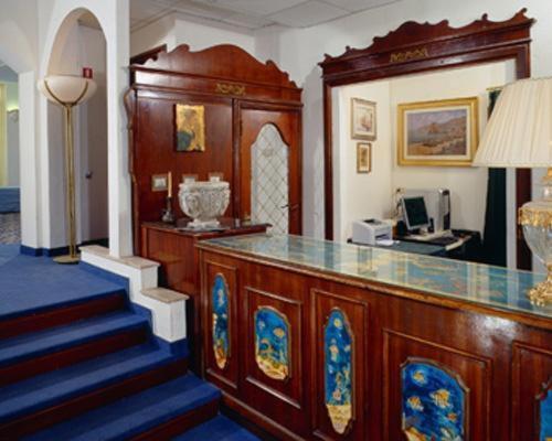 a room with a counter and a staircase in a room at Hotel Maremonti in Gabicce Mare