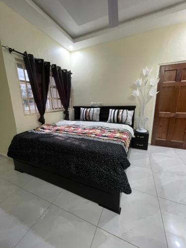 Postel nebo postele na pokoji v ubytování Danstels lodge