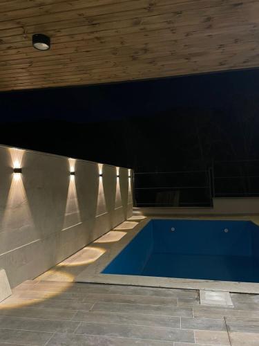 a swimming pool in a building with a ceiling at House In Dilijan in Dilijan