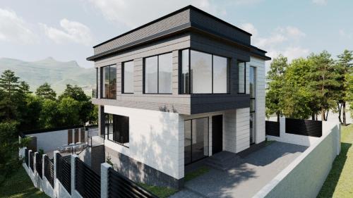 ein Bild eines Hauses mit schwarzem Dach in der Unterkunft Kenac Lerner Dilijan in Dilidschan