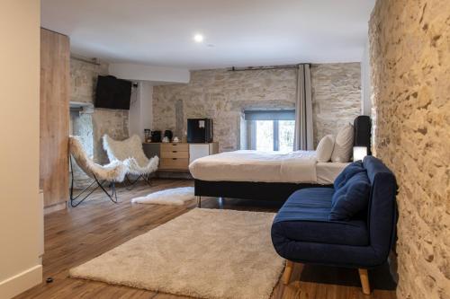 En eller flere senge i et værelse på Hôtel Séquoias