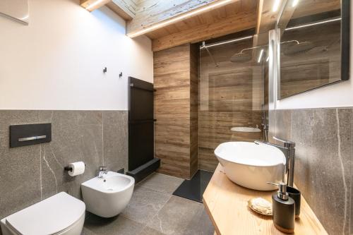a bathroom with a white toilet and a sink at - Piz Boe - Canazei center app. in Canazei