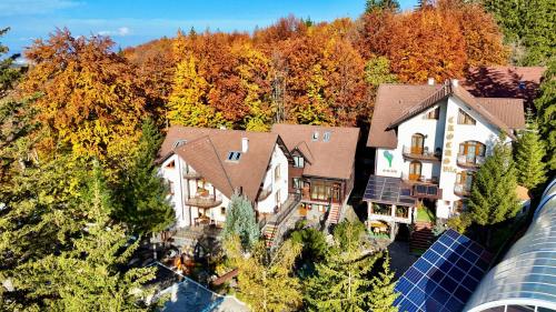 an aerial view of a house with a solar array at Pensiunea Crocus - Sauna & Billiard in Poiana Brasov