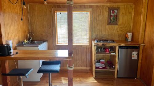 Een keuken of kitchenette bij Cabañas Kuela
