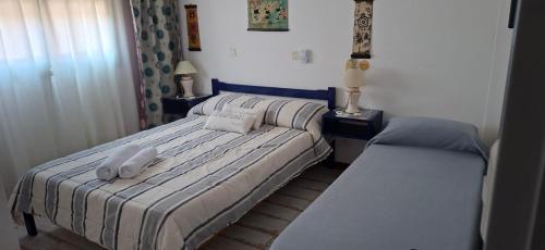 En eller flere senge i et værelse på Posada de la Villa