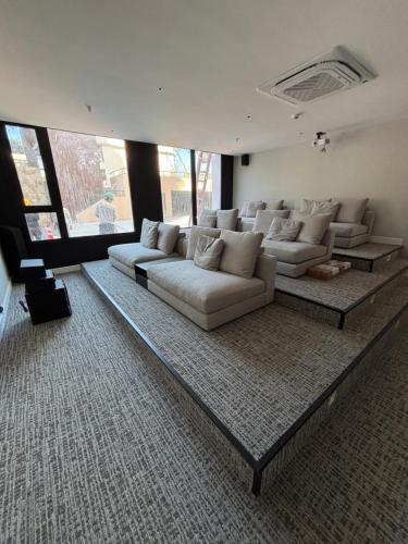 a large living room with couches and a rug at Sea Garden Tower 2 in Punta del Este