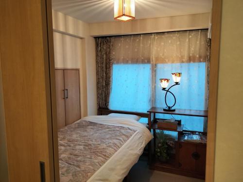 Giường trong phòng chung tại 源氏民宿