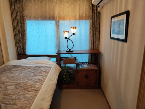 Giường trong phòng chung tại 源氏民宿