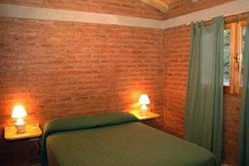 En eller flere senge i et værelse på Cabañas encantado