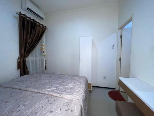 Ein Bett oder Betten in einem Zimmer der Unterkunft Villa 3 Bedroom Padma Huis Rancamaya