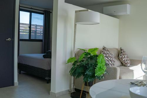 a living room with a couch and a bed at Mosch Apartments in Noord