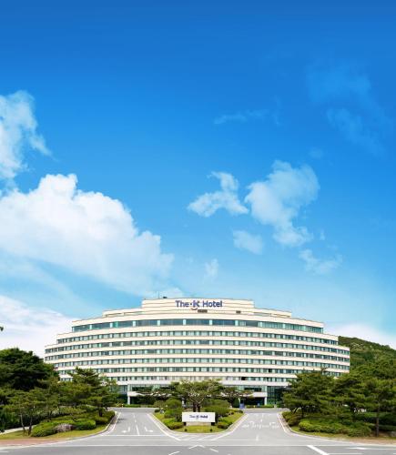 a large white building with the sign on it at The K Hotel Gyeongju in Gyeongju