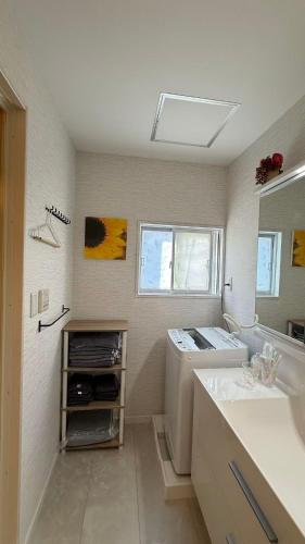 a bathroom with a sink and a mirror at Near Mitaka Museum of Art in Mitaka