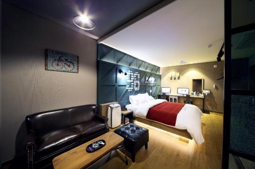 En eller flere senge i et værelse på Venice Hotel