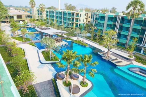an aerial view of a pool at a resort at LPN Cha-am Beachfront Wifi 10 meters to beach 1BR ติดทะเล in Cha Am