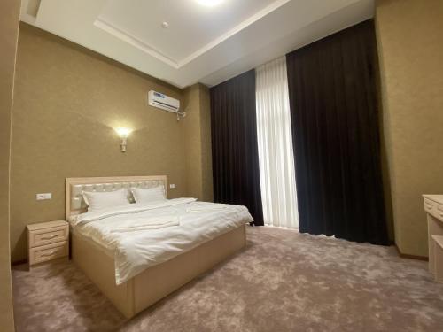 Postel nebo postele na pokoji v ubytování Violet Hotel