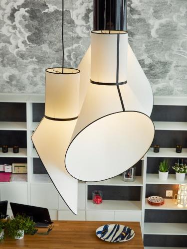 a room with three lights hanging from the ceiling at Hotel Mercure Brest Centre Les Voyageurs in Brest