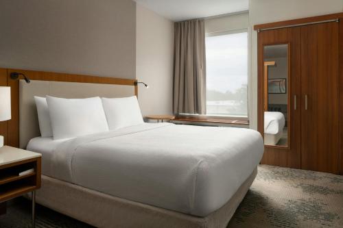 a hotel room with a large bed and a window at SpringHill Suites by Marriott Voorhees Mt. Laurel/Cherry Hill in Voorhees