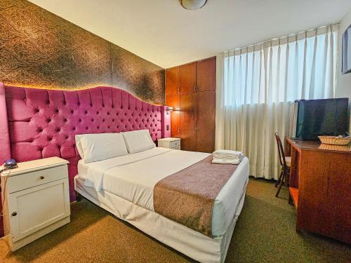 Giường trong phòng chung tại Rivero 520