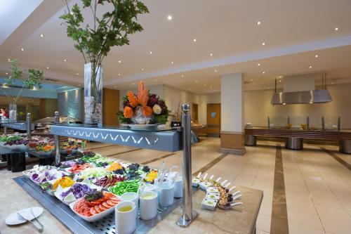 a buffet of food in the lobby of a hotel at Naama Bay Hotel & Resort in Sharm El Sheikh