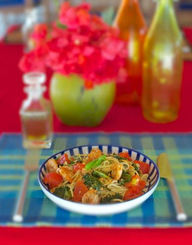 a bowl of food on a table with flowers at Dolphin Beach Resort in Kalpitiya