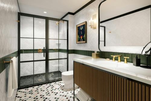 a bathroom with a sink and a shower at The Union Hotel, Flemington, a Tribute Portfolio Hotel in Flemington