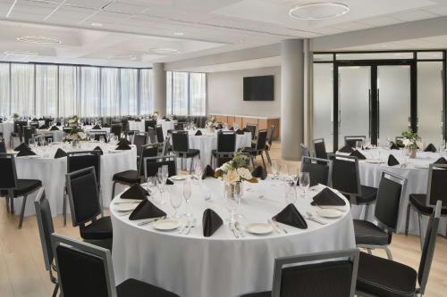 a banquet hall with white tables and chairs at Fairfield by Marriott Inn & Suites Durham in Durham