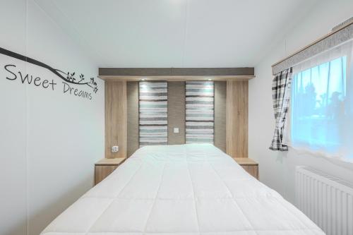 Postel nebo postele na pokoji v ubytování vakantiehuisje tis ier goed