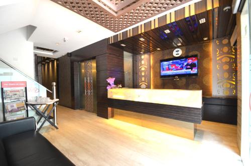 TV a/nebo společenská místnost v ubytování Hotel Metro View