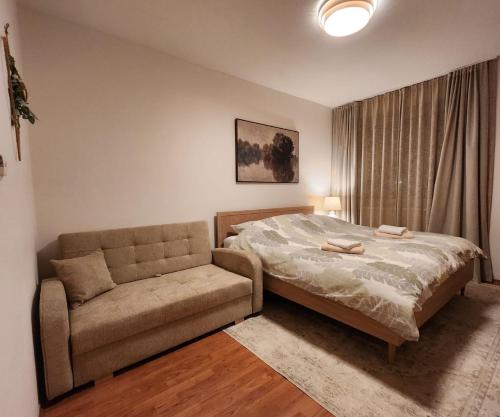 En eller flere senge i et værelse på Apartment Olivia