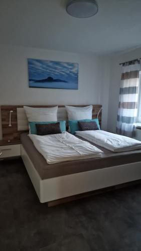 En eller flere senge i et værelse på Ferienhaus am Mühlgrundbach