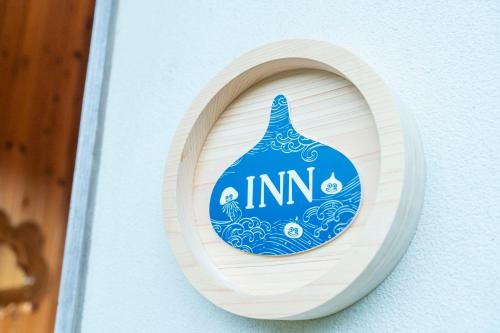 a blue and white sign on the side of a building at GRAND CHARIOT Hokutoshichisei 135° in Awaji