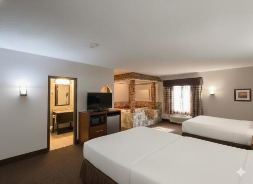 Postel nebo postele na pokoji v ubytování Country Inn & Suites by Radisson, Battle Creek, MI
