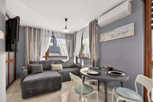 a living room with a couch and a table at Dany's Apartments in Varna City