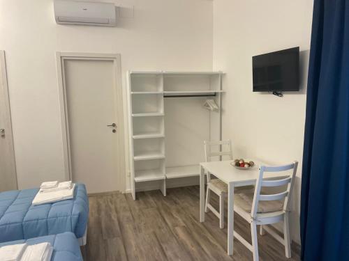 En eller flere senge i et værelse på La Casa Sul Viale