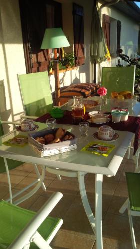 a white table with food on top of it at Chambres d'hôte de Sauviolle in Frontenac