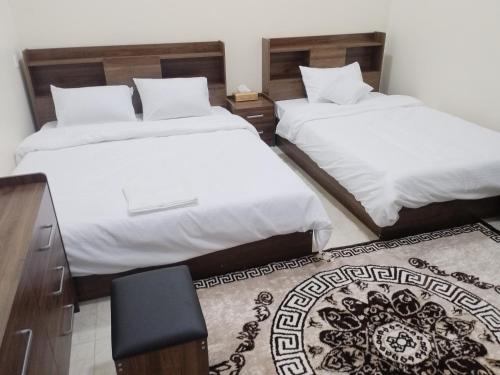เตียงในห้องที่ سمارا أدم SAMARA Adam