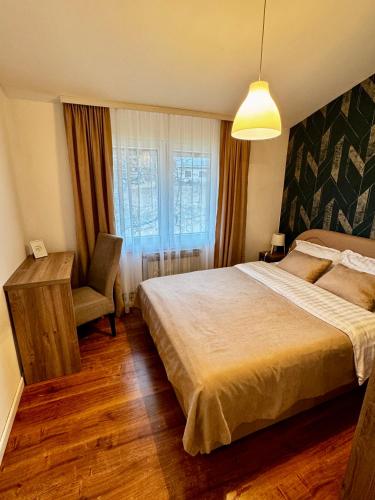Llit o llits en una habitació de Vikend kuća Planinski raj
