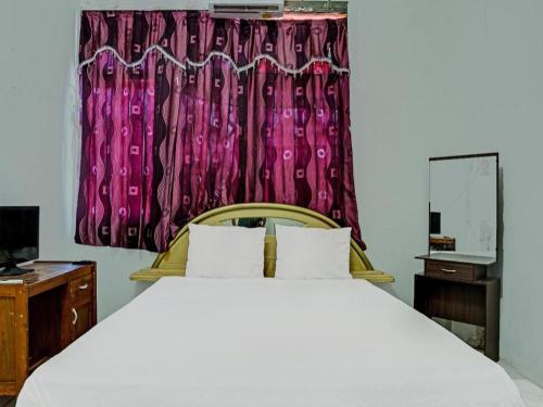 Postel nebo postele na pokoji v ubytování Hotel O Kost Axcel