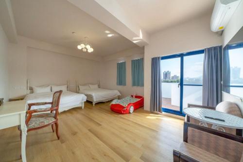 En eller flere senge i et værelse på 騎驢找馬民宿