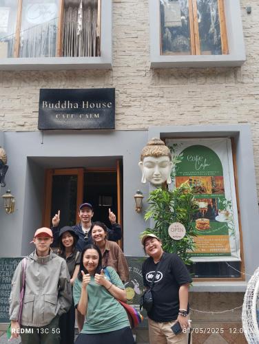 a group of people standing in front of a building at Buddha house 2 in Kasol