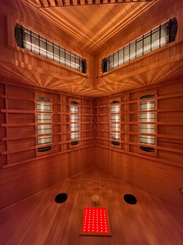 a meditation room with a red table in the middle at Villa Eva & Lilou Pod Rysianką in Żabnica