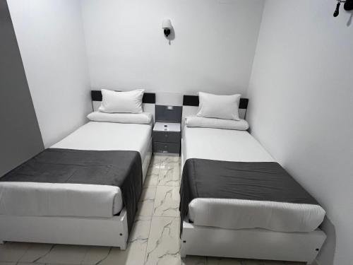 Ein Bett oder Betten in einem Zimmer der Unterkunft Ali Baba Guest House