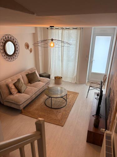 Khu vực ghế ngồi tại Maison proche centre-ville et Futuroscope