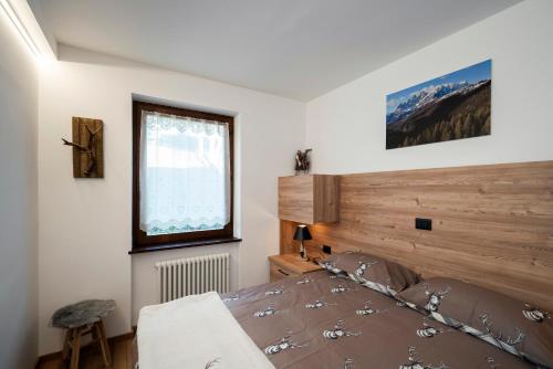 En eller flere senge i et værelse på Happiness 14